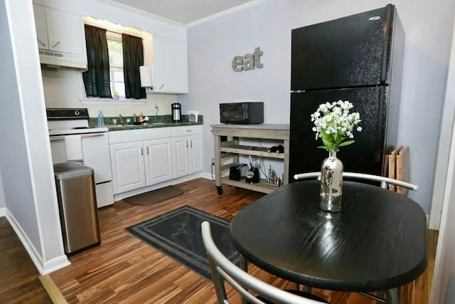 kitchen with black appliances, dark wood-style flooring, white cabinets, and under cabinet range hood