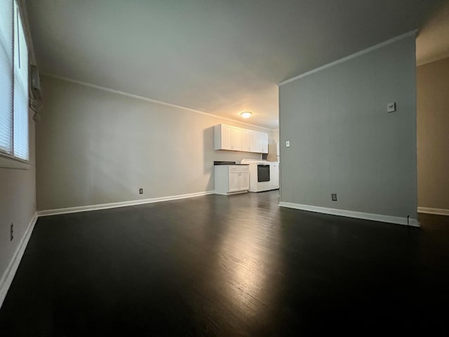 unfurnished living room with ornamental molding, dark wood-style flooring, and baseboards