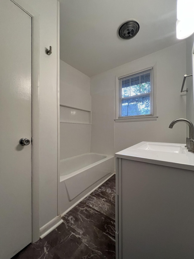 full bath featuring marble finish floor and vanity