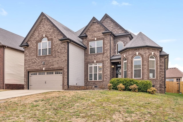 view of front facade with concrete driveway, brick siding, and crawl space