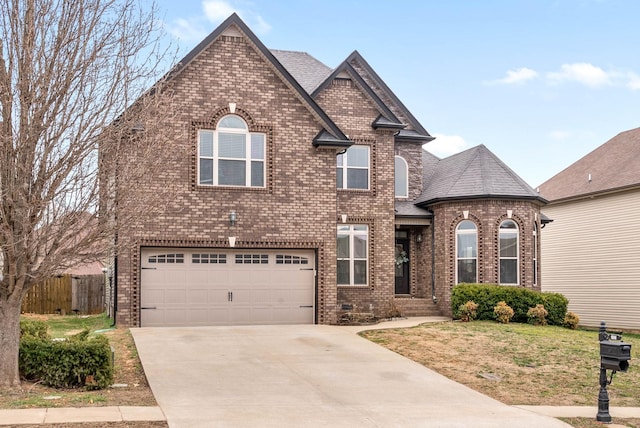 view of front of house with a shingled roof, fence, concrete driveway, and brick siding