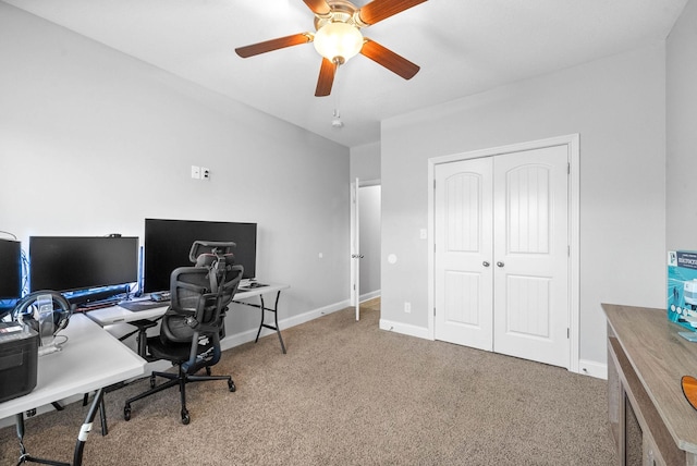 carpeted home office featuring ceiling fan and baseboards