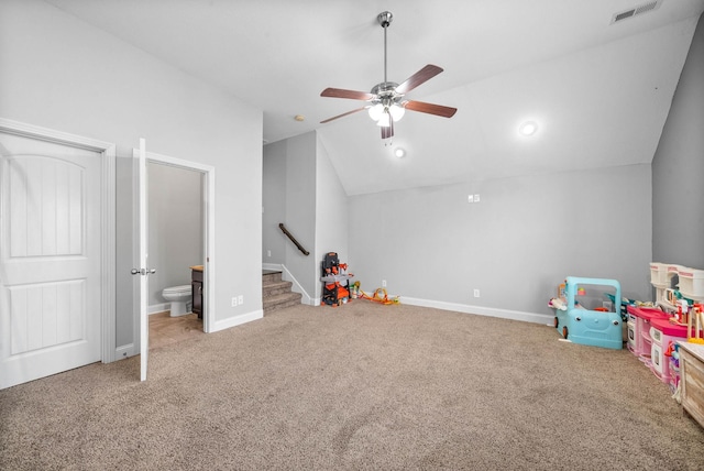 rec room featuring lofted ceiling, baseboards, visible vents, and carpet flooring