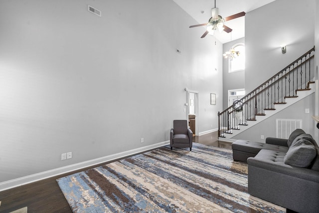 living room with visible vents, stairway, and baseboards