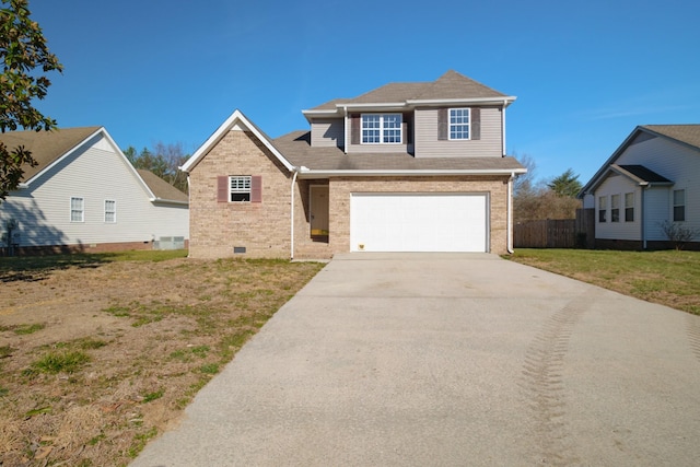 traditional-style home with an attached garage, brick siding, fence, concrete driveway, and crawl space