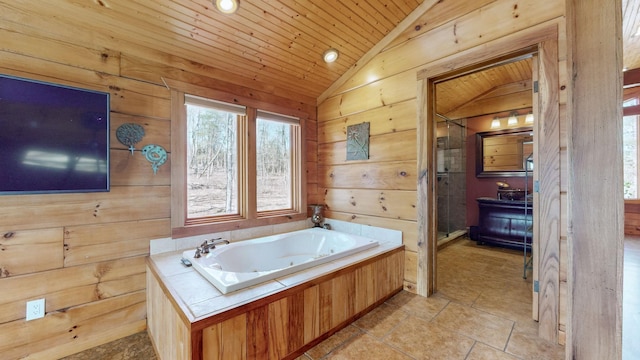 bathroom featuring wood ceiling, wooden walls, a tub with jets, and vaulted ceiling