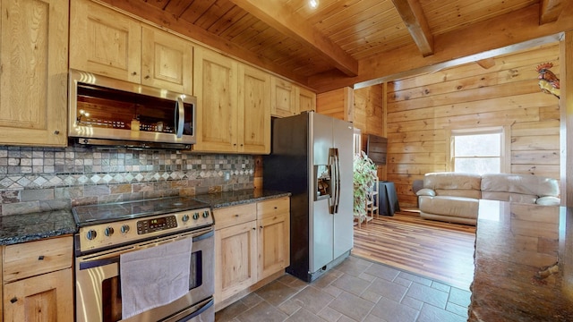 kitchen with wood ceiling, wood walls, tasteful backsplash, and appliances with stainless steel finishes