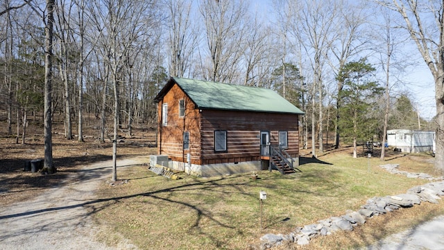 view of outdoor structure featuring central air condition unit and dirt driveway