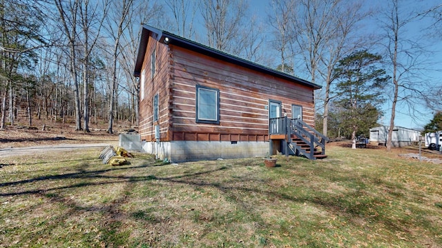 view of home's exterior with crawl space, central AC, and a yard