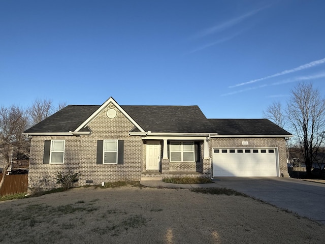 ranch-style house with driveway, a garage, a shingled roof, fence, and brick siding