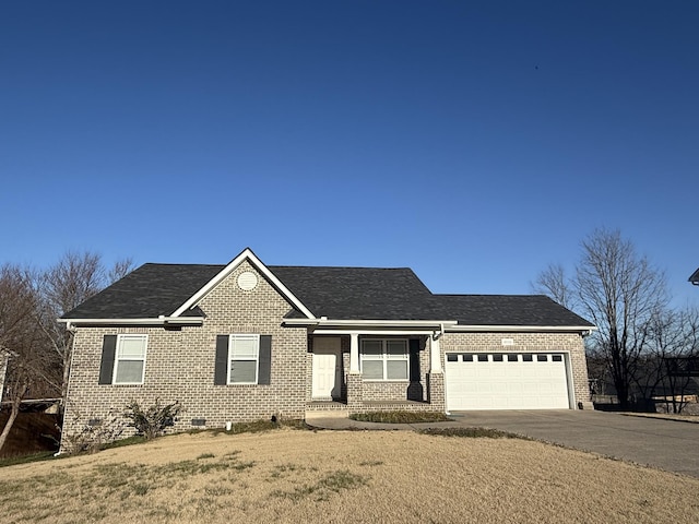 view of front of house with an attached garage, concrete driveway, and brick siding