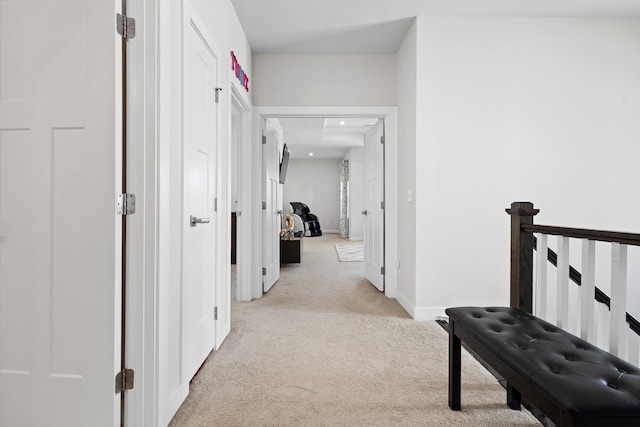 hallway with light carpet, baseboards, and recessed lighting