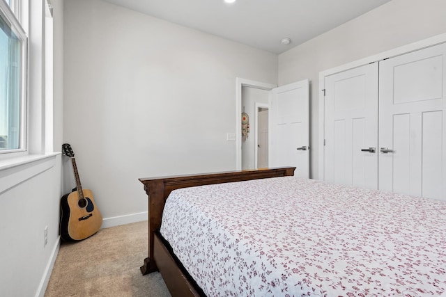 carpeted bedroom with baseboards