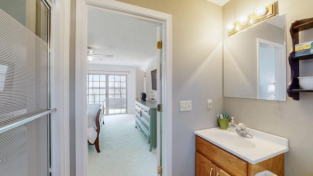 bathroom featuring ceiling fan and vanity