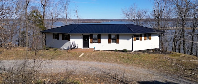 view of front of home with metal roof and stucco siding