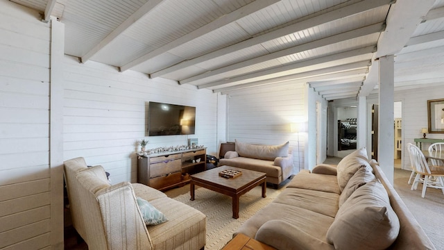 living room with beamed ceiling