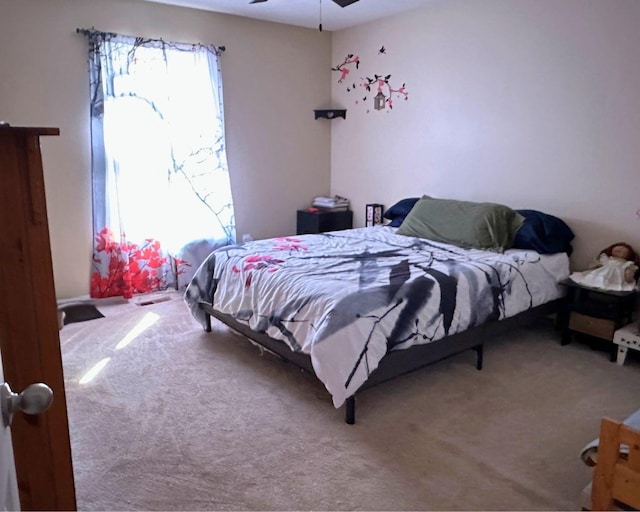 carpeted bedroom featuring a ceiling fan