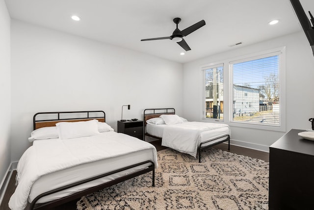 bedroom featuring recessed lighting, visible vents, ceiling fan, wood finished floors, and baseboards