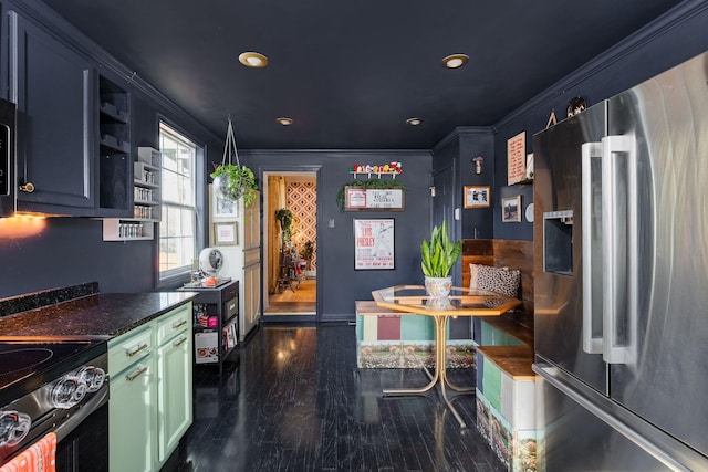 kitchen with stainless steel fridge with ice dispenser, ornamental molding, recessed lighting, dark wood-style floors, and dark countertops