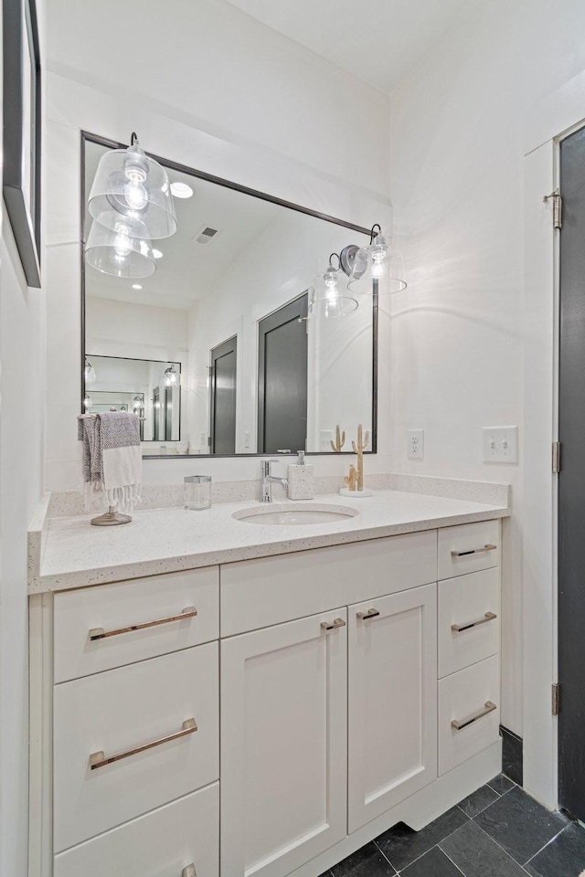 bathroom with visible vents and vanity