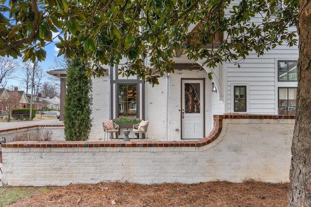 view of front of house with brick siding