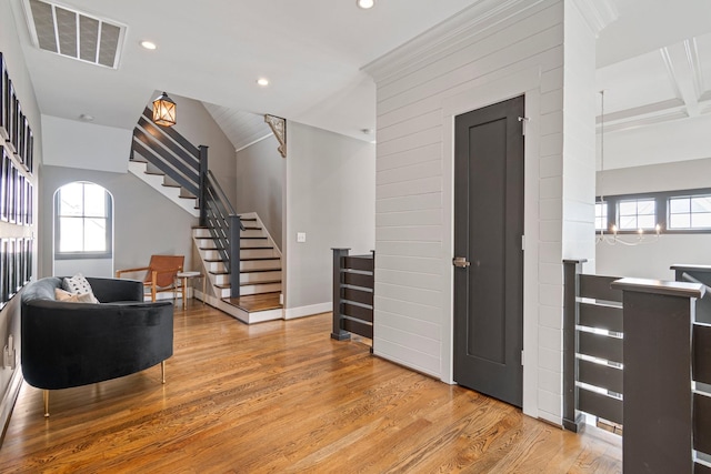 interior space with a wealth of natural light, wood finished floors, visible vents, and recessed lighting