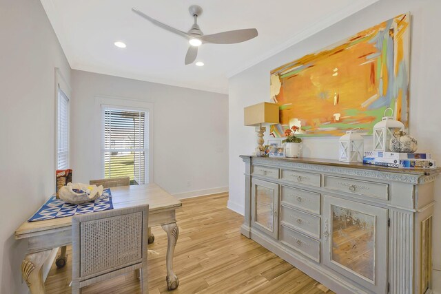 interior space with crown molding, light wood finished floors, recessed lighting, a ceiling fan, and baseboards