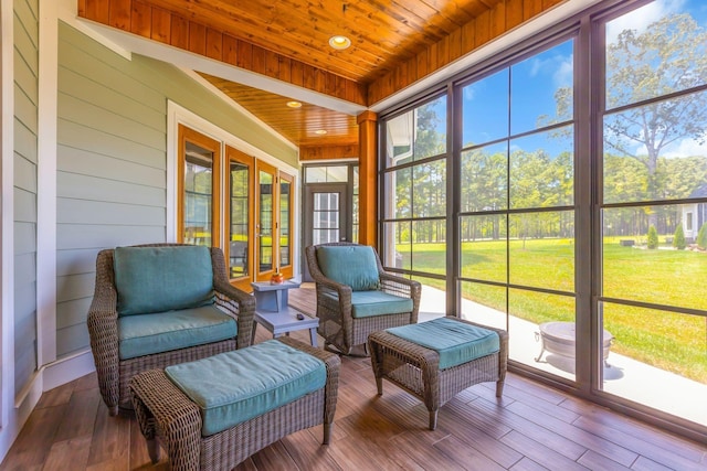 sunroom / solarium featuring wood ceiling
