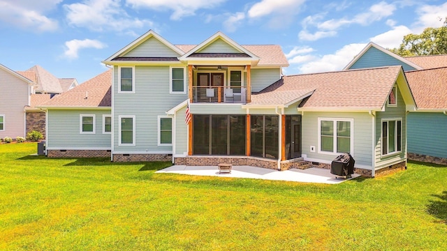 back of property with a yard, a patio, a sunroom, crawl space, and a balcony