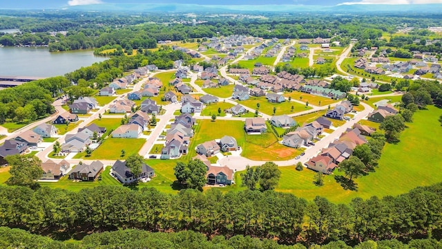 drone / aerial view with a water view and a residential view