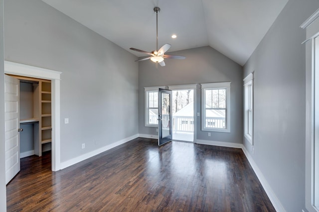 spare room with baseboards, dark wood finished floors, ceiling fan, vaulted ceiling, and recessed lighting