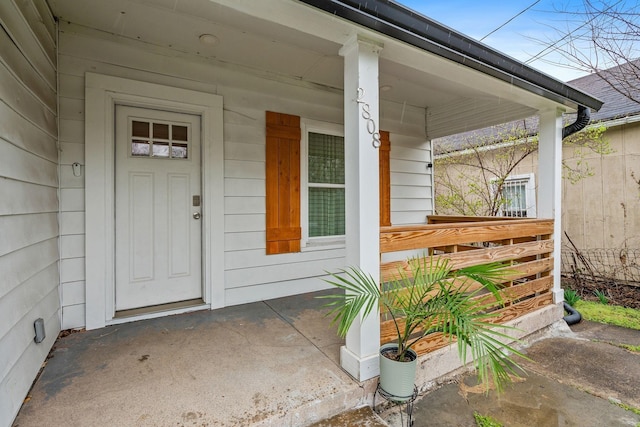 entrance to property featuring a porch