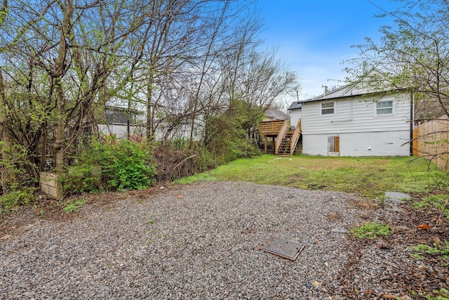 view of yard featuring stairway and a wooden deck