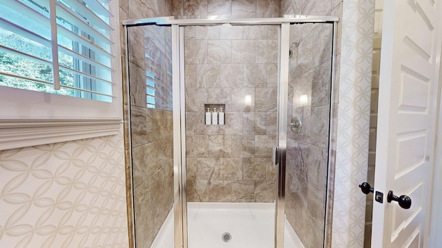 bathroom with a shower stall