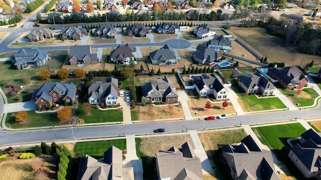 birds eye view of property with a residential view