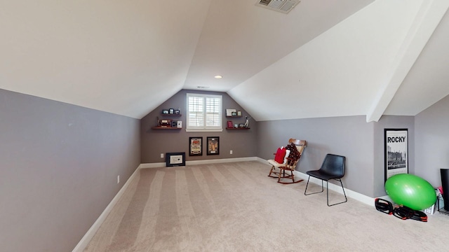 unfurnished room with lofted ceiling, carpet, visible vents, and baseboards