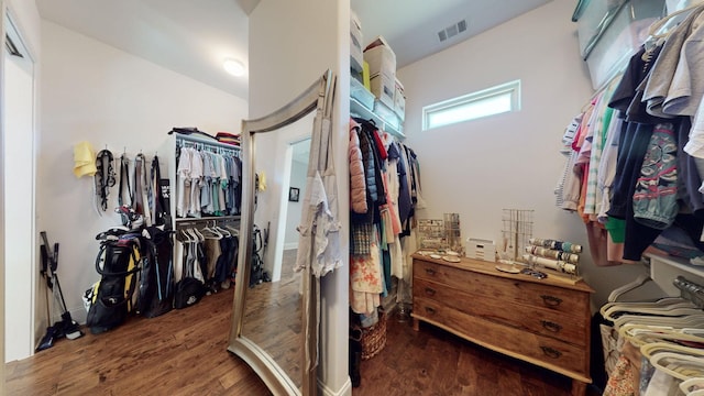 spacious closet featuring wood finished floors and visible vents