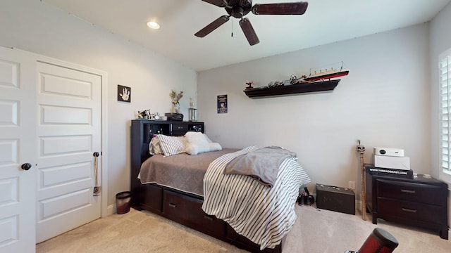 carpeted bedroom with ceiling fan and recessed lighting