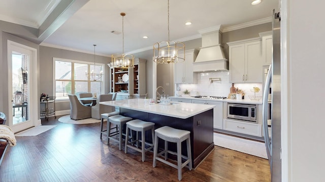 kitchen featuring white cabinetry, appliances with stainless steel finishes, backsplash, dark wood-style floors, and custom range hood