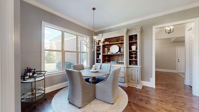 dining space featuring a chandelier, dark wood-type flooring, and crown molding