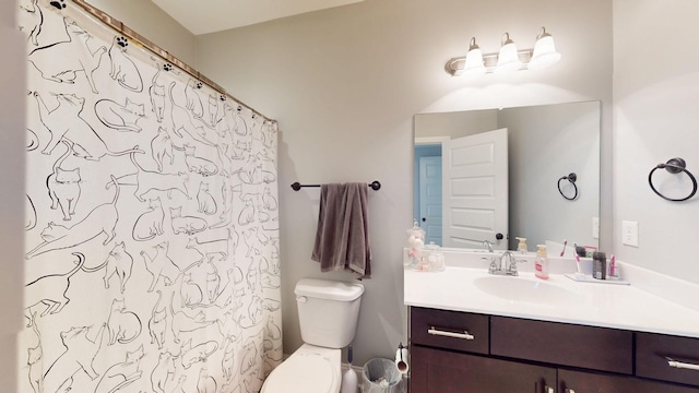 bathroom with toilet, a shower with shower curtain, and vanity