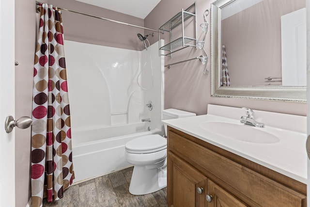 full bath featuring shower / bath combo with shower curtain, vanity, toilet, and wood finished floors