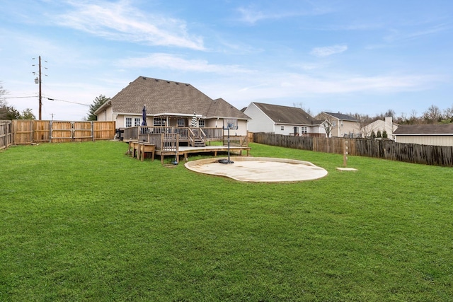 exterior space with a fenced backyard, a patio, a deck, and a lawn