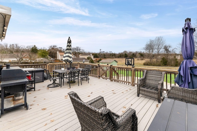 wooden deck with outdoor dining space