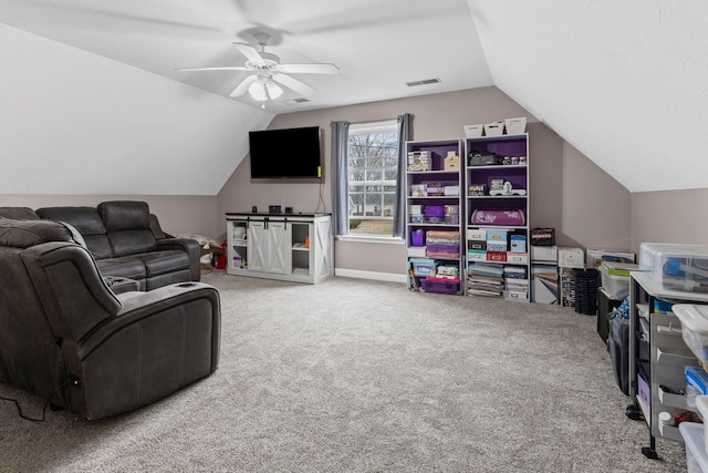 interior space featuring visible vents, vaulted ceiling, baseboards, and ceiling fan