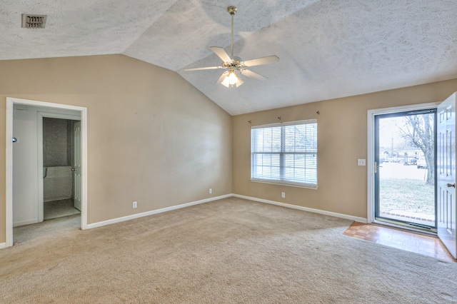 interior space featuring carpet floors, a healthy amount of sunlight, and visible vents