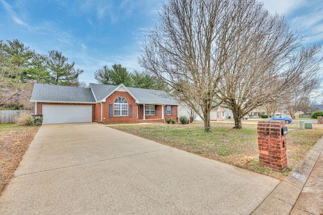 single story home with a garage, concrete driveway, fence, a front lawn, and brick siding