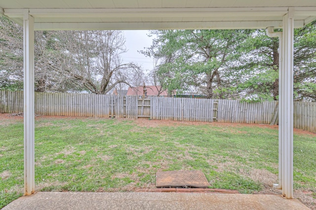 view of yard with a fenced backyard