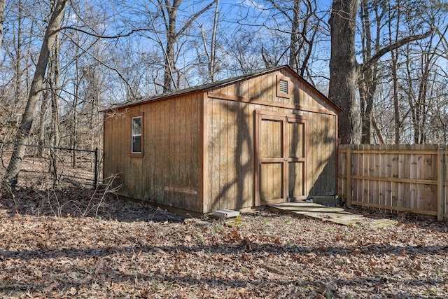 view of shed with fence