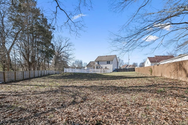 view of yard with a fenced backyard